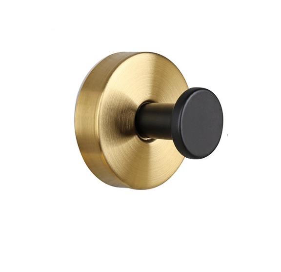 Stilren väggkrok i guld och svart